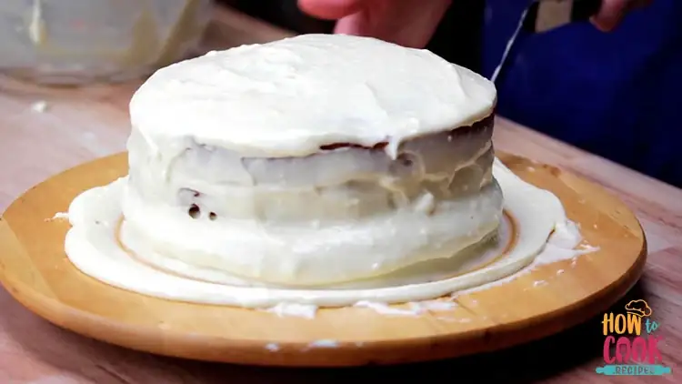 Frosting the homemade carrot cake