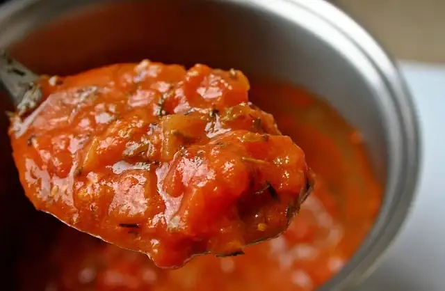 A spoonful of tomato sauce.